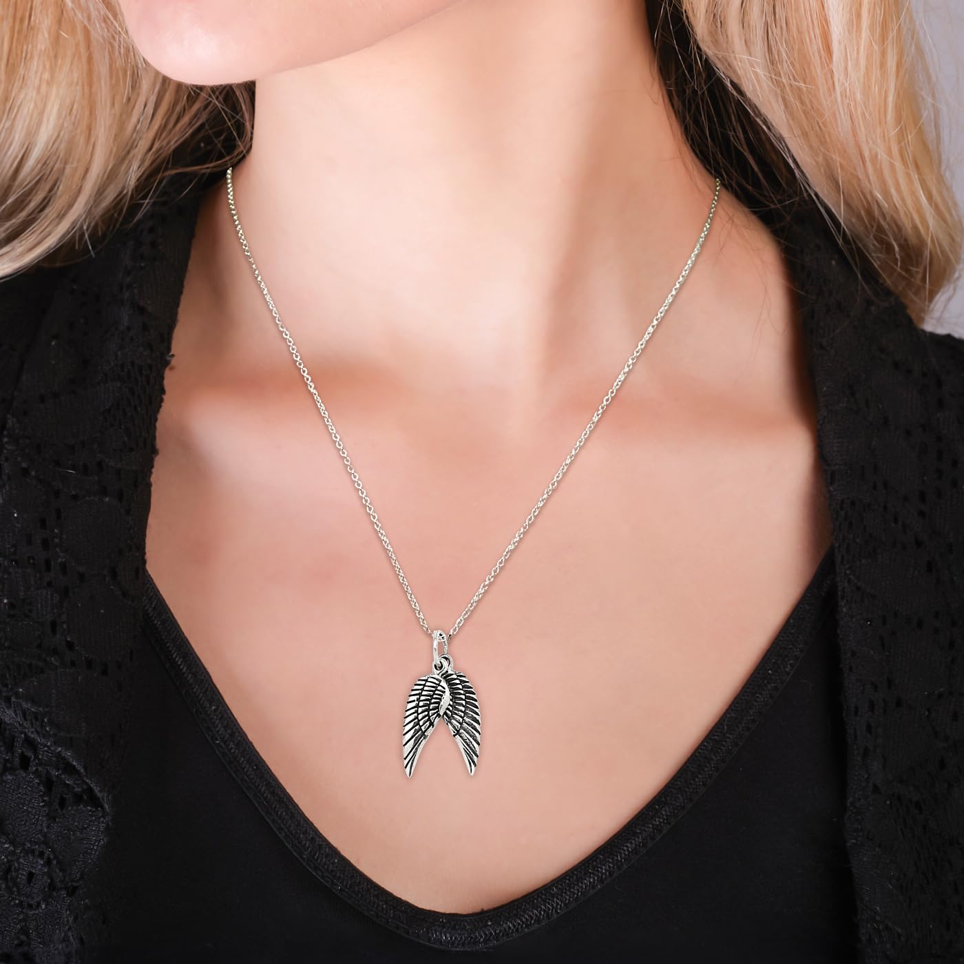 Sterling Silver Angel Wings Pendant on Female Model